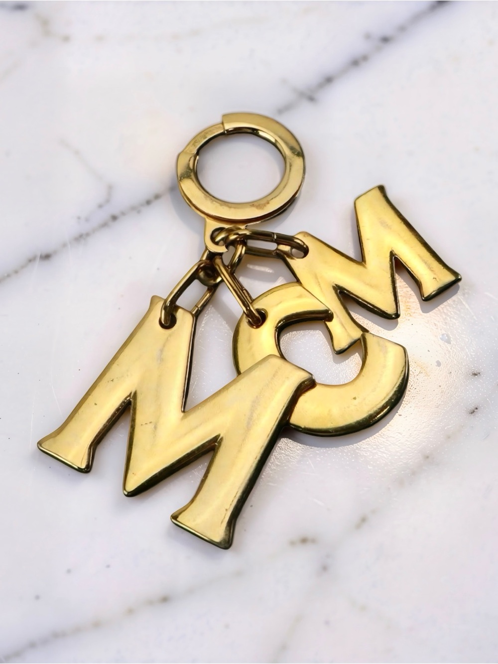 MCM Brass Monogram Logo Keychain Bag Charm Gold Tone
